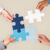 hands-holding-puzzle-business-problem-solving-concept