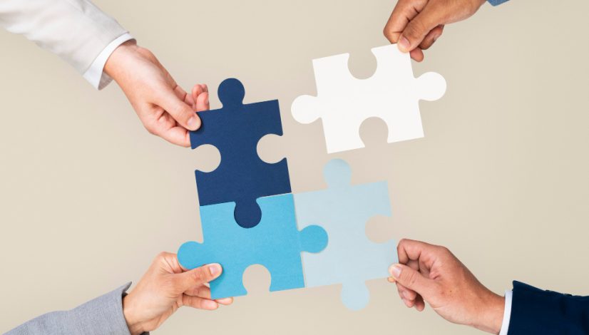 hands-holding-puzzle-business-problem-solving-concept